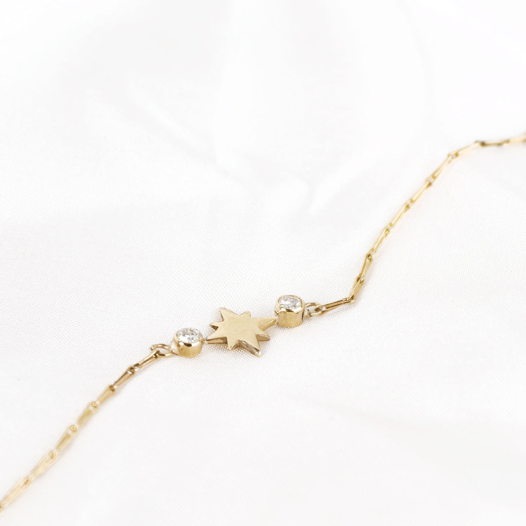 Lavey London's Solid 9ct Gold Lab Grown Diamond North Star Station Necklace Styled On A White Soft Fabric