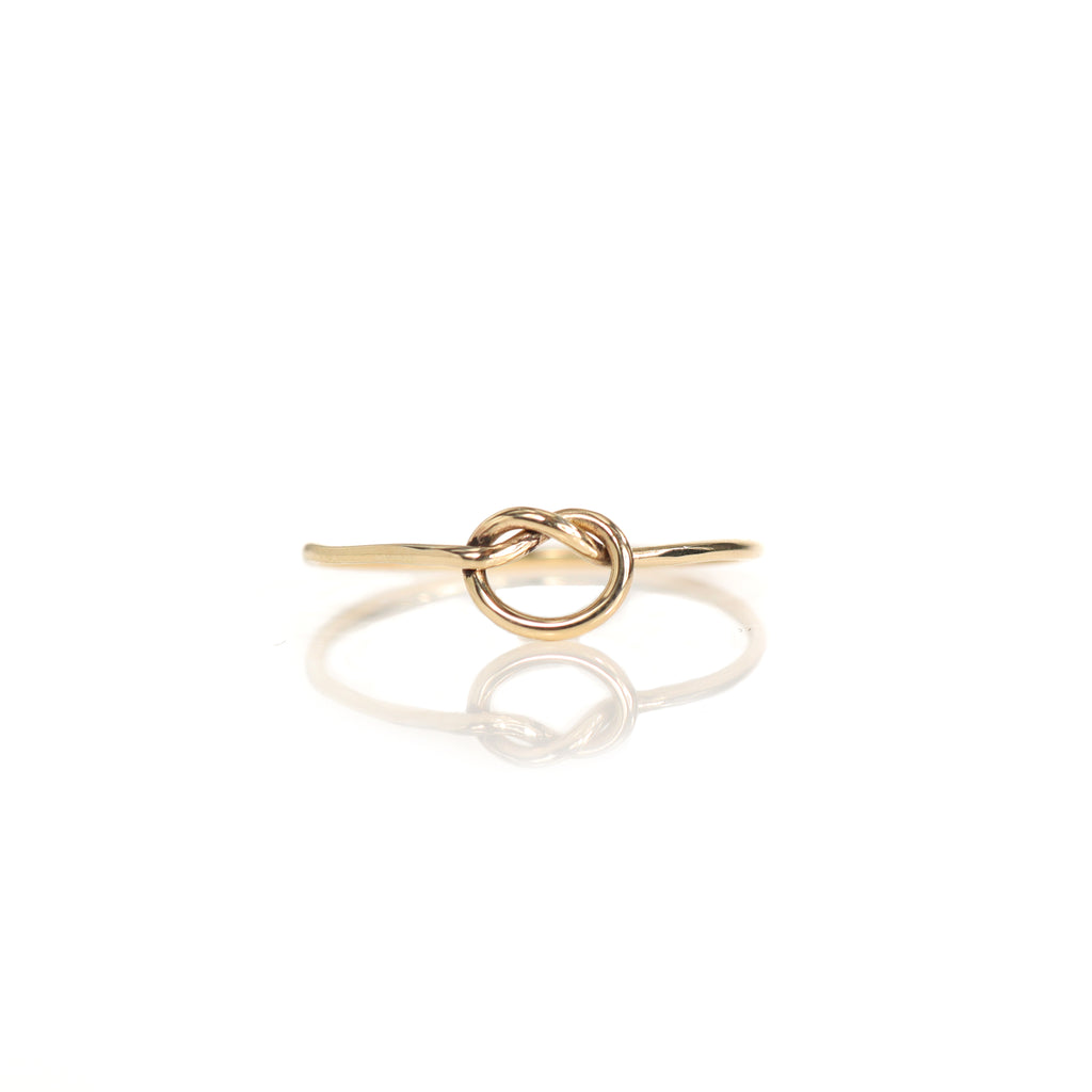 Lavey London's Solid 9ct Gold Love Knot Infinity Ring shown against a white background